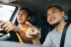 father training son to driving a car 2024 05 06 17 41 48 utc Resized